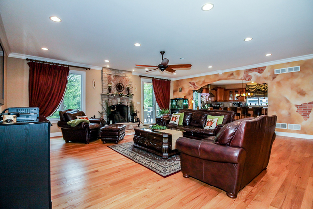 813 Elmdale Road Glenview, IL 60025 - Photo 5 of 26 a living room with fireplace furniture and a large window