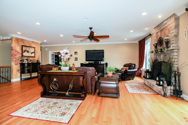 813 Elmdale Road Glenview, IL 60025 - Photo 7 of 26 a living room with furniture and a flat screen tv
