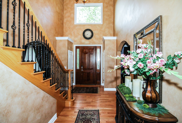 813 Elmdale Road Glenview, IL 60025 - Photo 10 of 26 a vase of flowers sitting on a floor