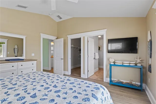 a view of hallway with wooden floor