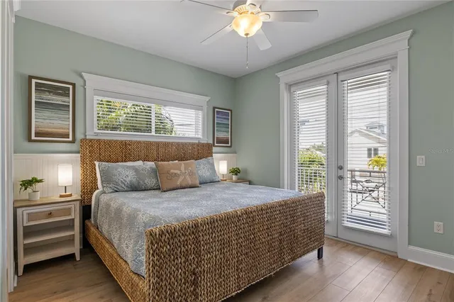 a spacious bathroom with a granite countertop double vanity sink a mirror and shower