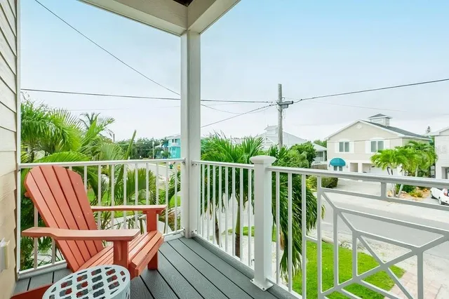 a aerial view of a house with a yard and potted plants