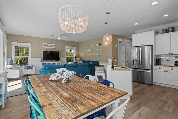 a kitchen with stainless steel appliances granite countertop a refrigerator stove and sink