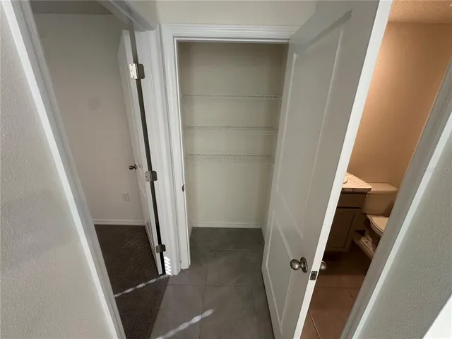 a view of a room with racks on the wall