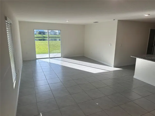 a kitchen with a sink a stove a refrigerator a microwave and cabinets