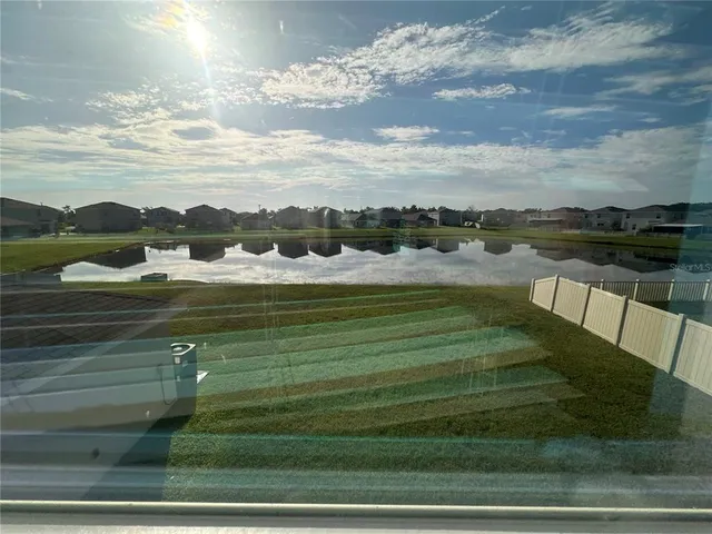 a front view of a house with a big yard
