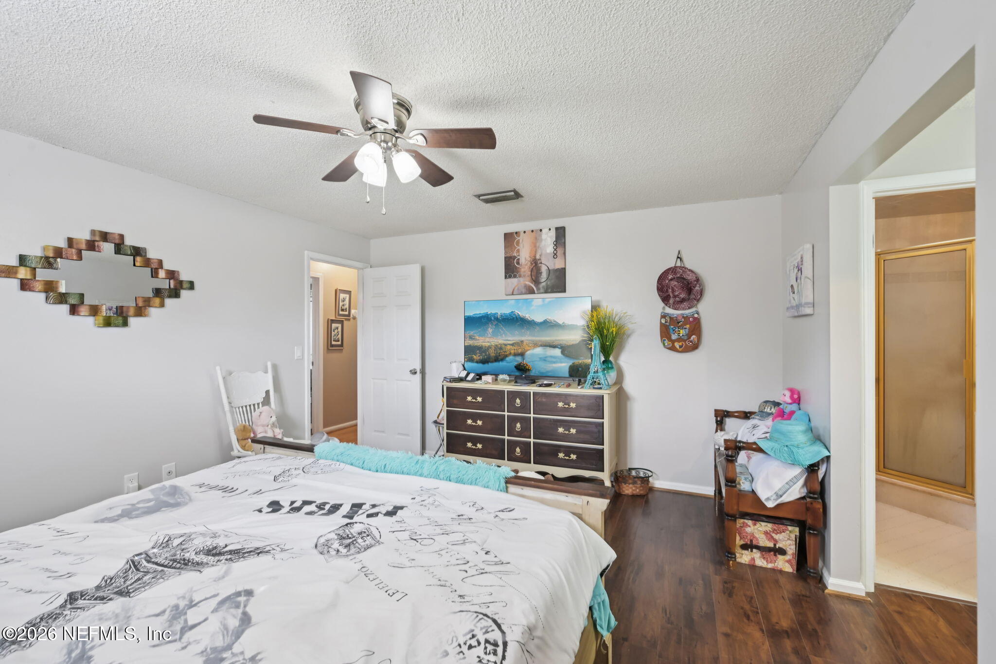 2749 Richards Road Orange Park, FL 32073 - Photo 11 of 26 a bedroom with a bed and wooden floor
