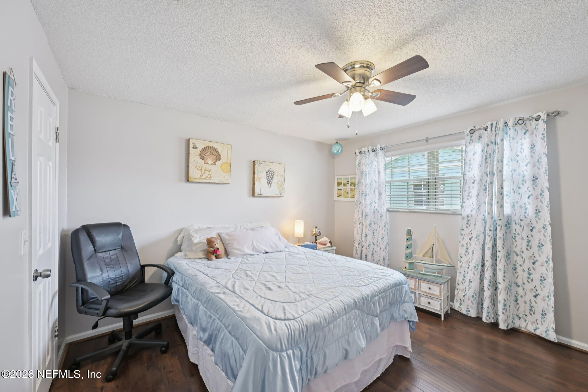 2749 Richards Road Orange Park, FL 32073 - Photo 16 of 26 a bedroom with a bed and a chandelier