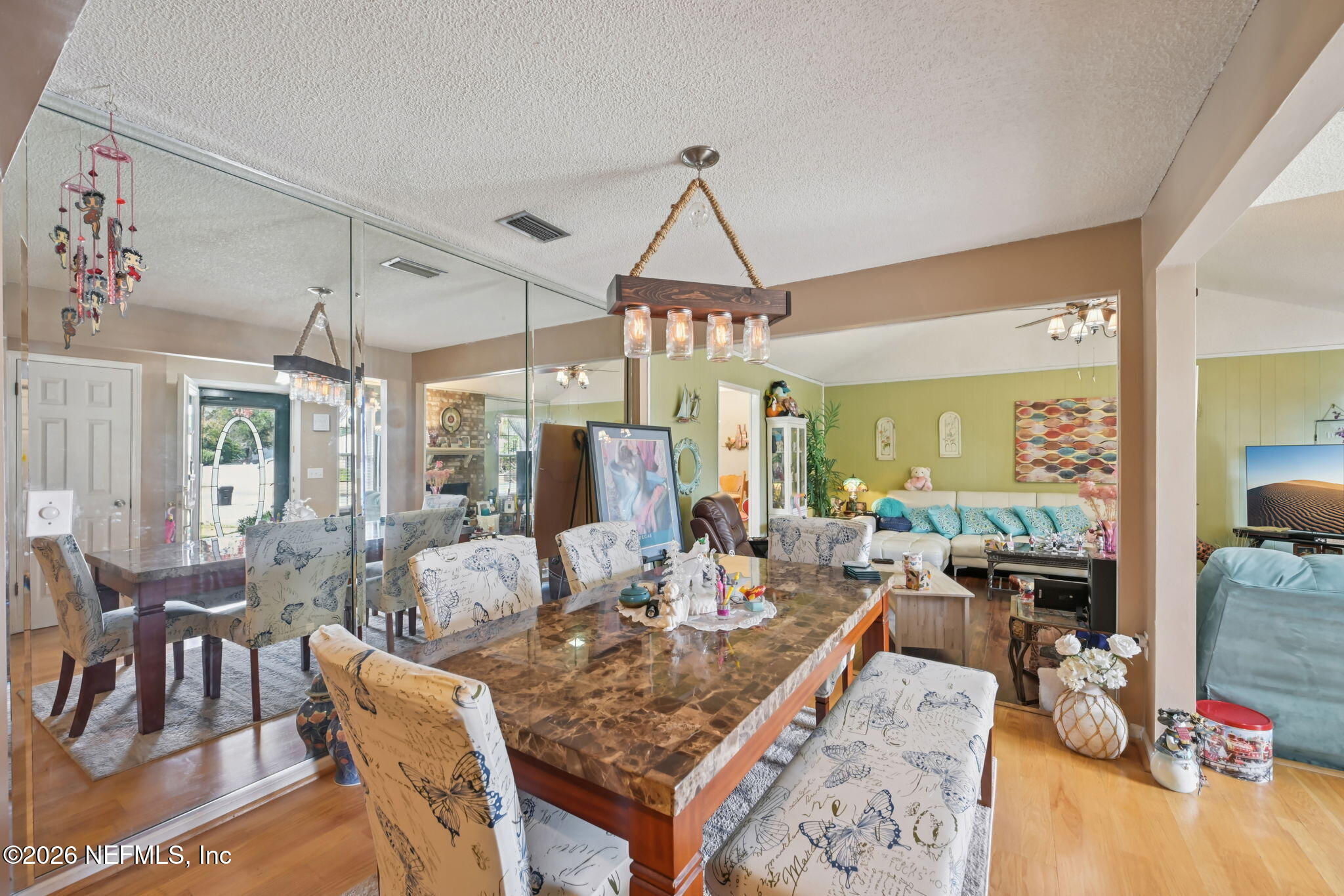 2749 Richards Road Orange Park, FL 32073 - Photo 5 of 26 a view of a dining room with furniture window and wooden floor