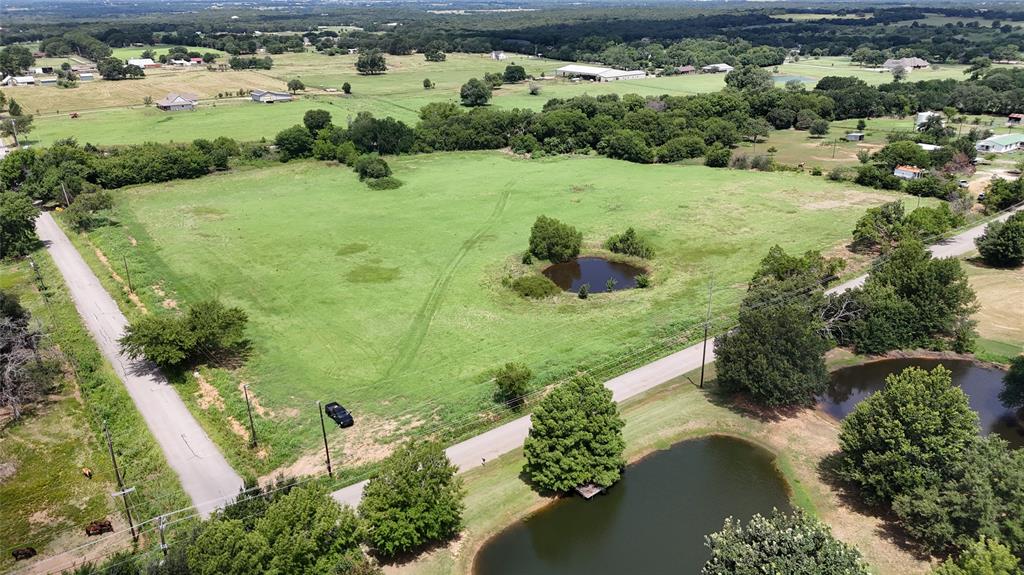 Lot 3 New Hope Road Aubrey, TX 76227 - Photo 3 of 8 an aerial view of a house with a yard