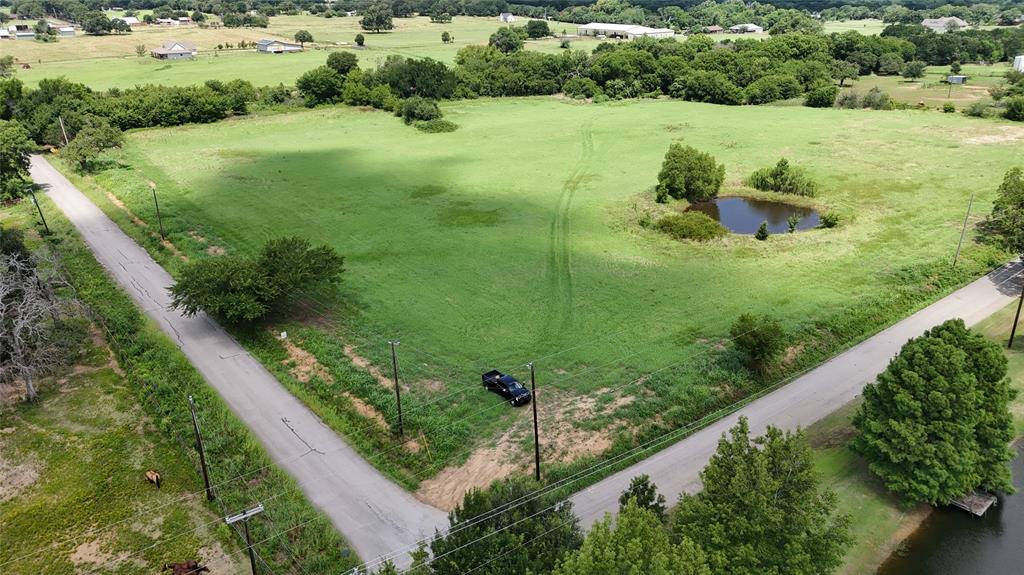 Lot 3 New Hope Road Aubrey, TX 76227 - Photo 5 of 8 a view of a garden with a lake