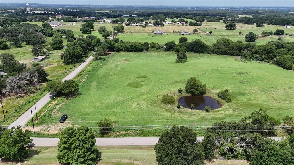 Lot 3 New Hope Road Aubrey, TX 76227 - Photo 7 of 8 an aerial view of residential houses with outdoor space and trees
