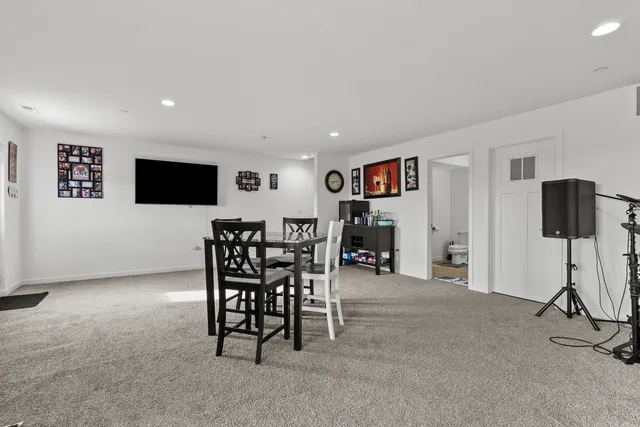 a view of a livingroom with furniture and a flat screen tv