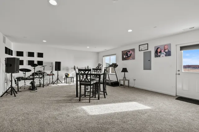 a view of a livingroom with furniture and a flat screen tv