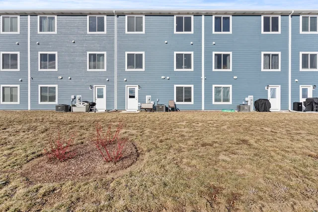 a large building with a bench in front of it