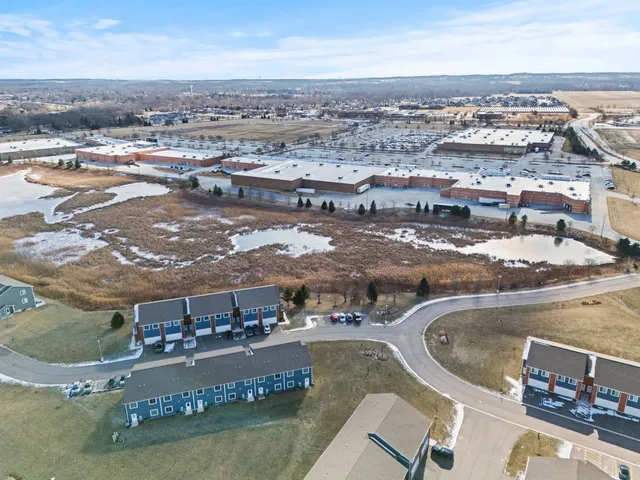 an aerial view of residential houses with outdoor space