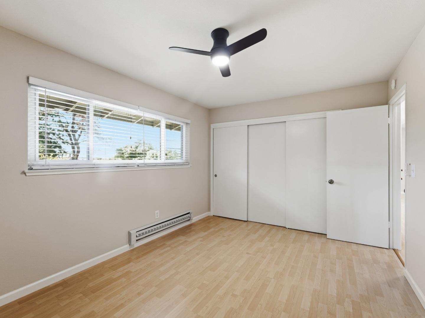 607 Valley Forge Way, Unit 4 Campbell, CA 95117 - Photo 8 of 12 a view of empty room with wooden floor and fan