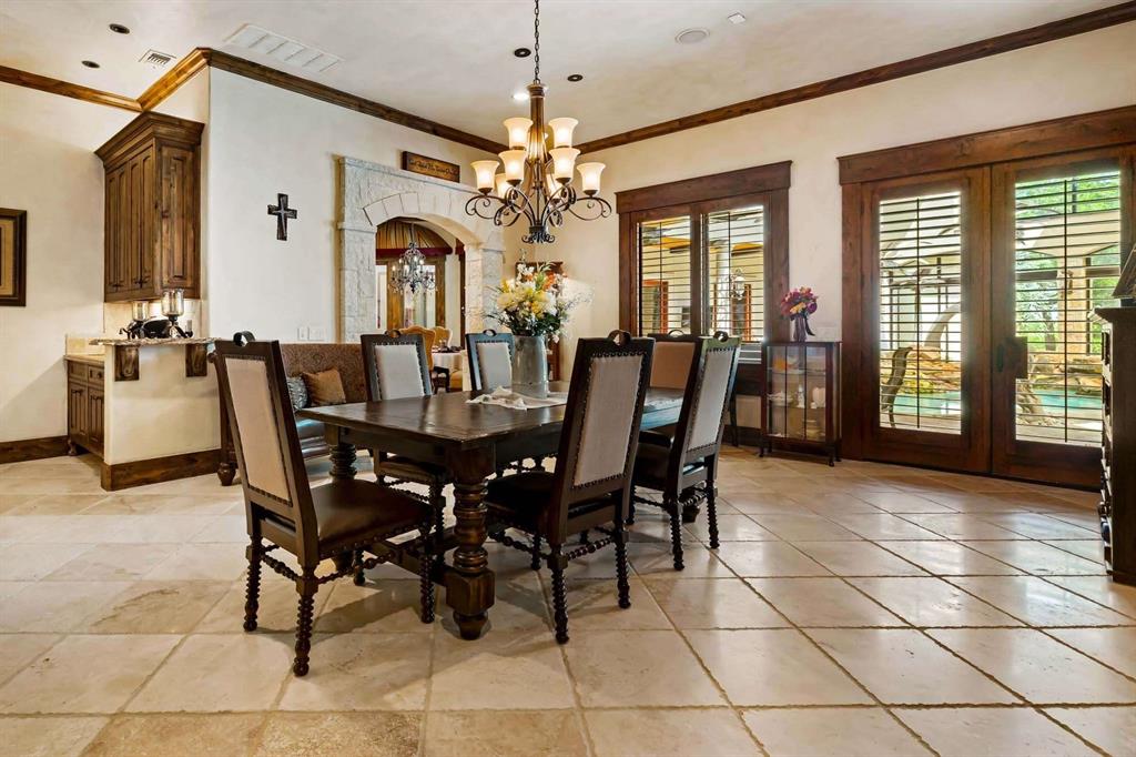 2115 Paradise Rnch Trail McKinney, TX 75071 - Photo 20 of 40 Dining area featuring expansive tile flooring and a built-in wet bar with wood cabinetry and a light-toned countertop