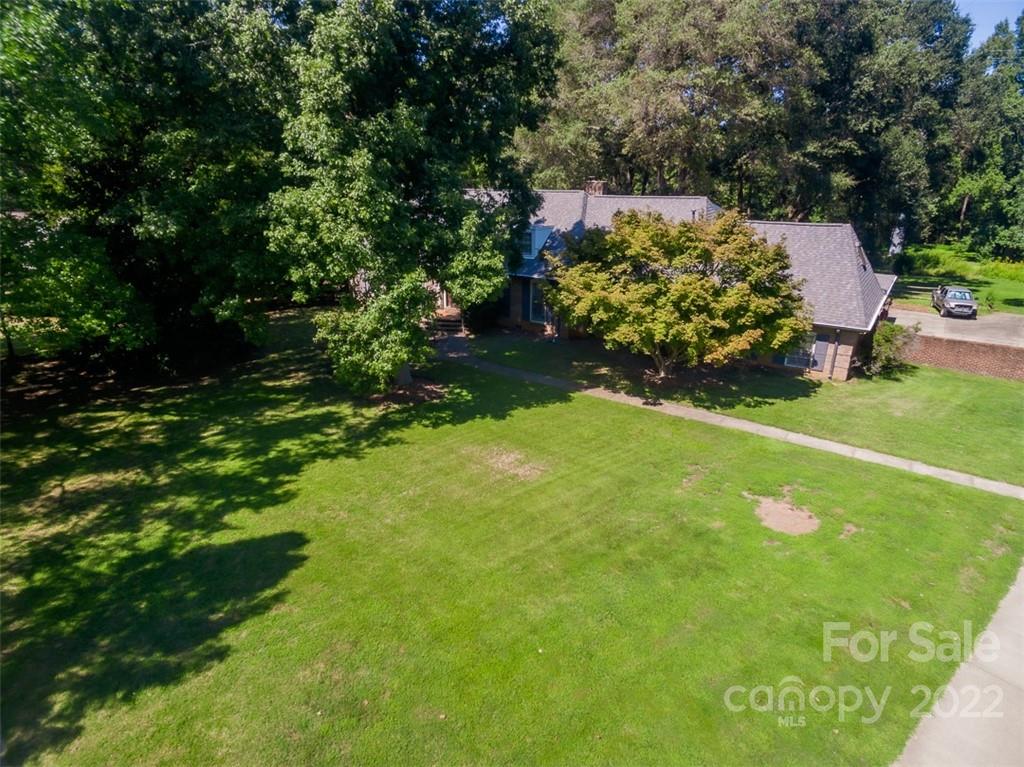a backyard of a house with lots of green space