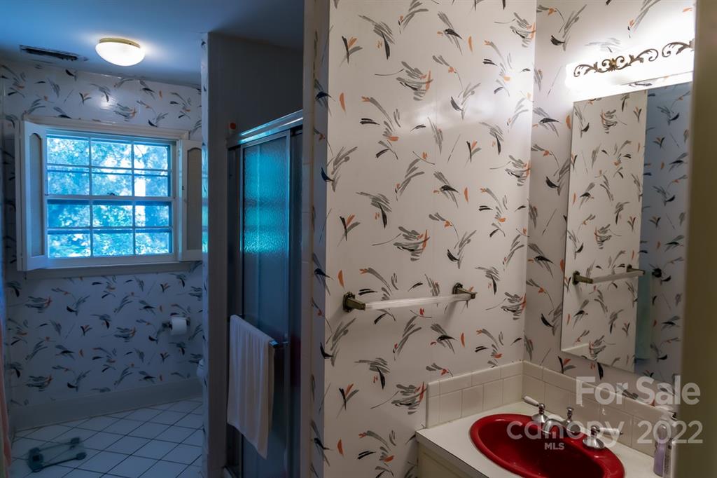 7300 Lancer Drive Charlotte, NC 28226 - Photo 20 of 48 a bathroom with a bathtub and shower