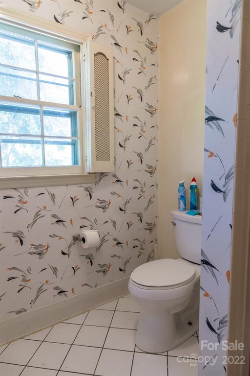 7300 Lancer Drive Charlotte, NC 28226 - Photo 21 of 48 a white toilet sitting next to a window
