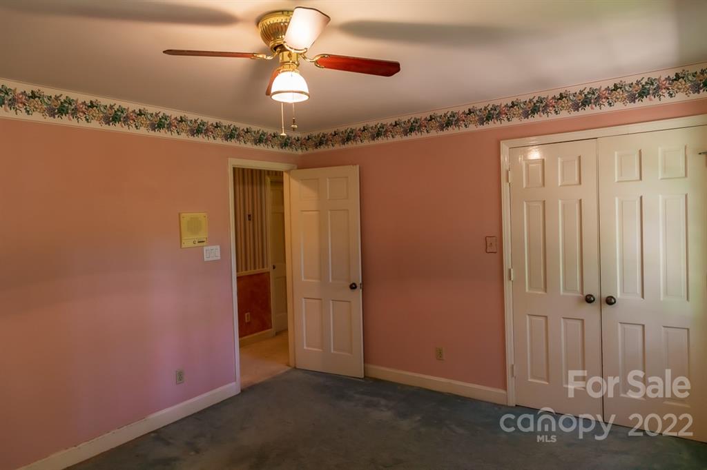 7300 Lancer Drive Charlotte, NC 28226 - Photo 24 of 48 an empty room with chandelier fan