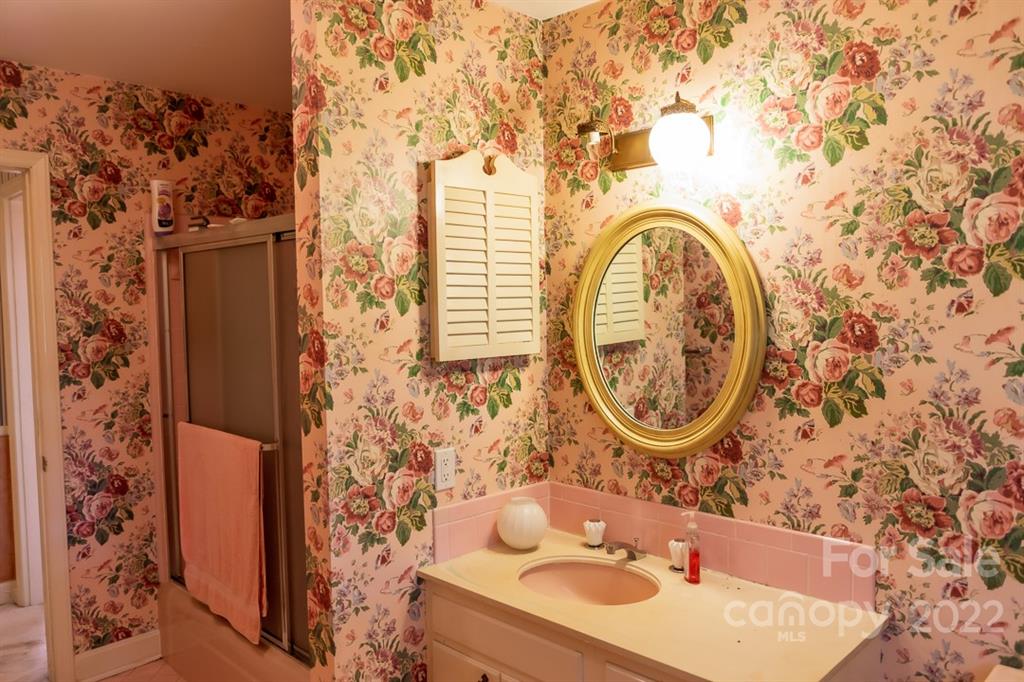 7300 Lancer Drive Charlotte, NC 28226 - Photo 28 of 48 a bathroom with a sink and a mirror