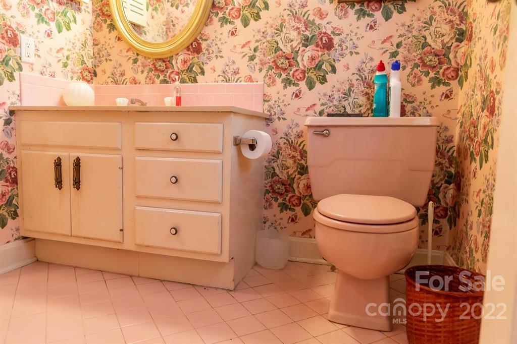 7300 Lancer Drive Charlotte, NC 28226 - Photo 29 of 48 a bathroom with a toilet and a mirror