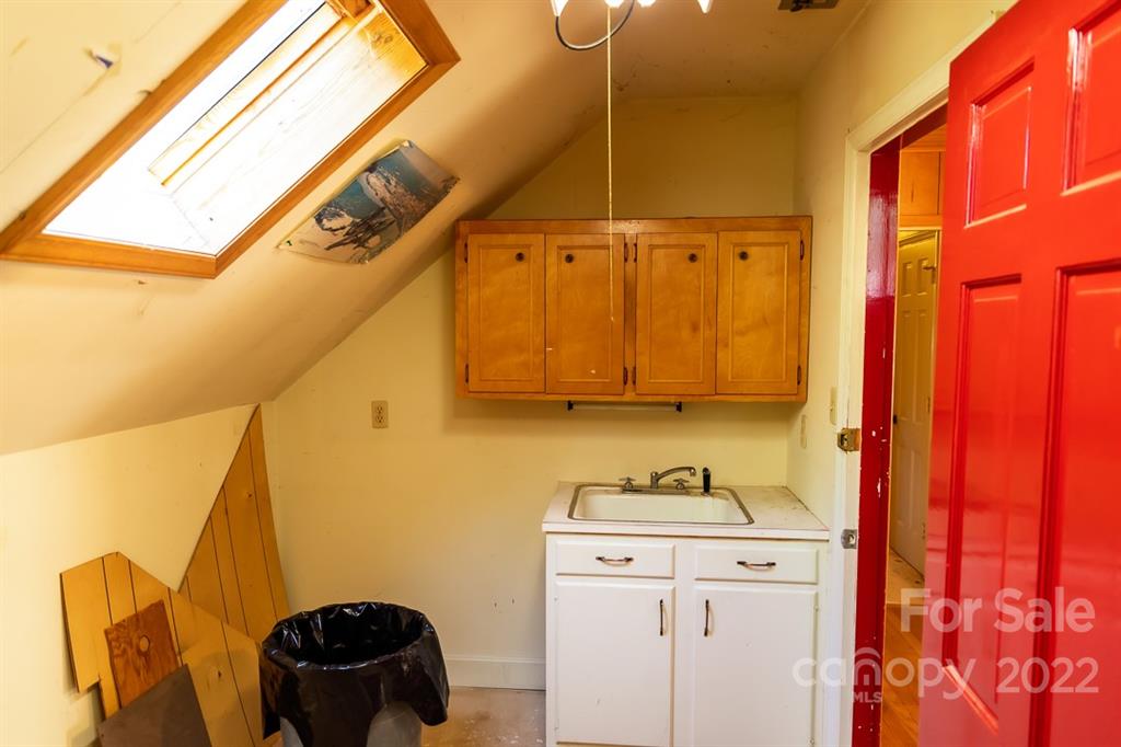 7300 Lancer Drive Charlotte, NC 28226 - Photo 33 of 48 a bathroom with a sink and a mirror
