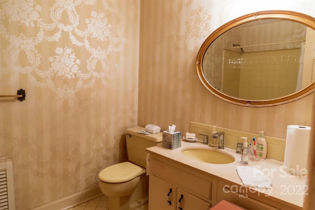 7300 Lancer Drive Charlotte, NC 28226 - Photo 36 of 48 a bathroom with a sink and a mirror