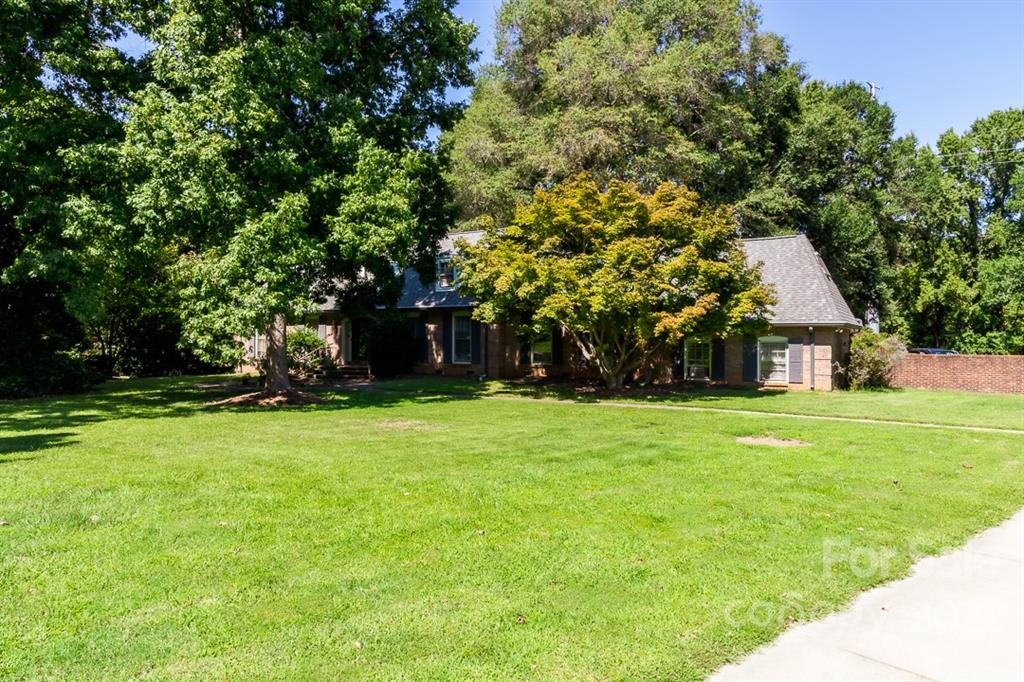 7300 Lancer Drive Charlotte, NC 28226 - Photo 39 of 48 a front view of a house with a yard