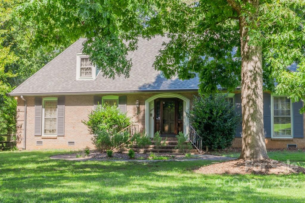 7300 Lancer Drive Charlotte, NC 28226 - Photo 40 of 48 a front view of a house with a garden
