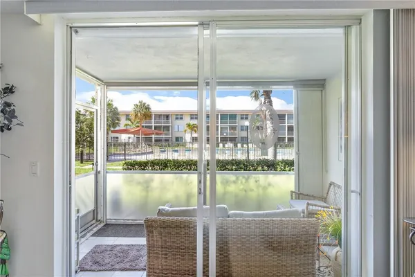 a view of a room with a large window