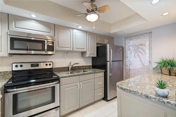 a kitchen with a stove microwave and refrigerator