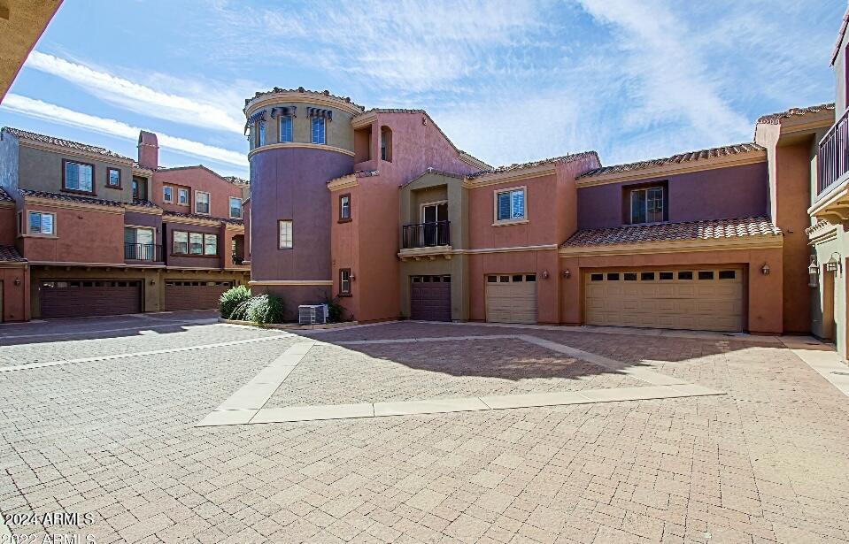 3935 East Rough Rider Road, Unit 1101 Phoenix, AZ 85050 - Photo 36 of 43 a front view of a building