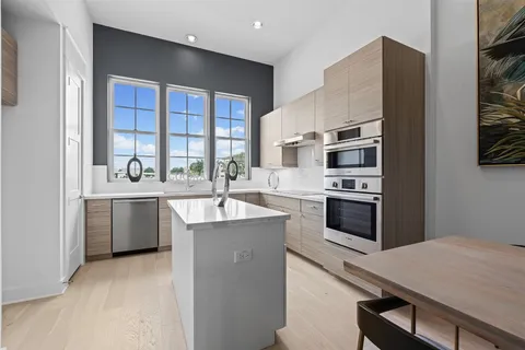 a kitchen with a sink stove and refrigerator