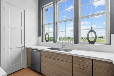 a kitchen with a sink and a window