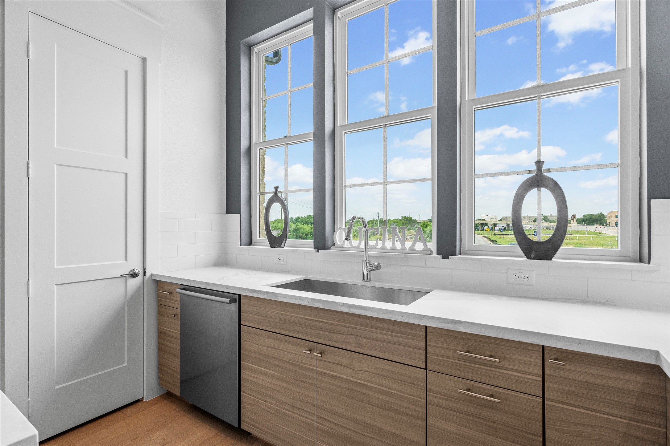 239 Watt Court Round Rock, TX 78664 - Photo 16 of 40 a kitchen with a sink and a window