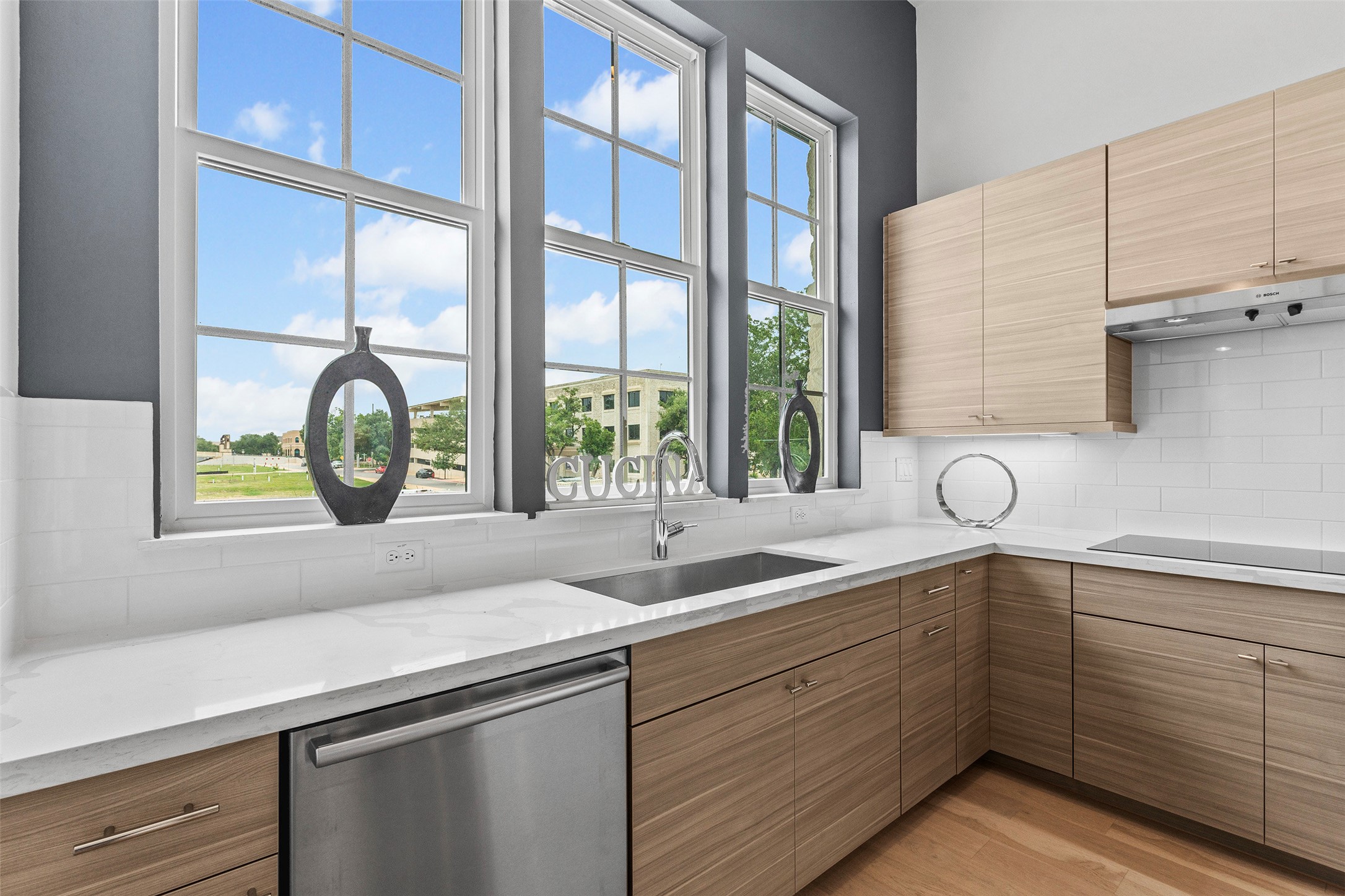 239 Watt Court Round Rock, TX 78664 - Photo 17 of 40 a bathroom with a granite countertop sink and a window