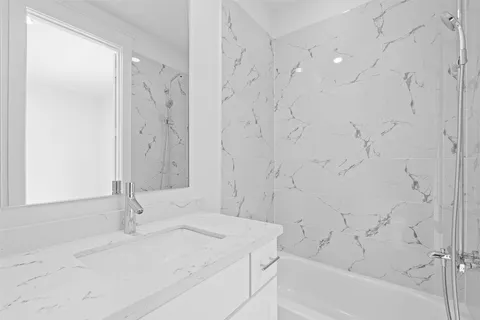 a bathroom with a sink and a bathtub