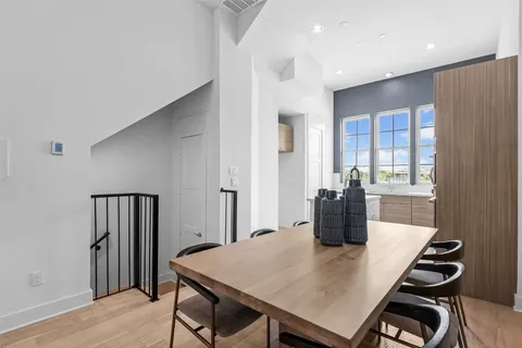 a kitchen with a table and chairs in it