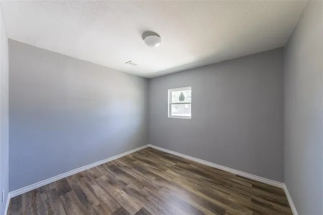 a view of a kitchen from the hallway
