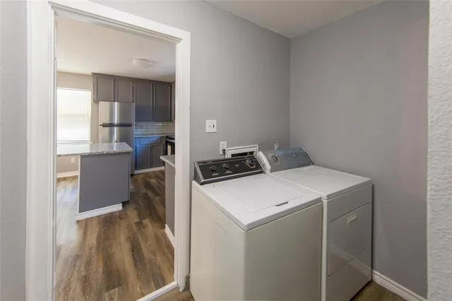 a view of a backyard with large trees