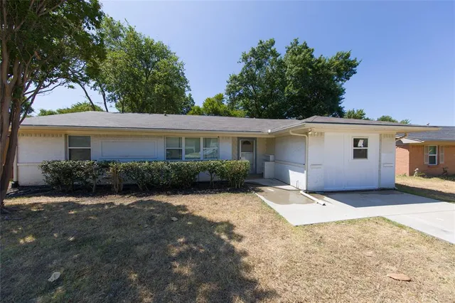 front view of a house with a patio