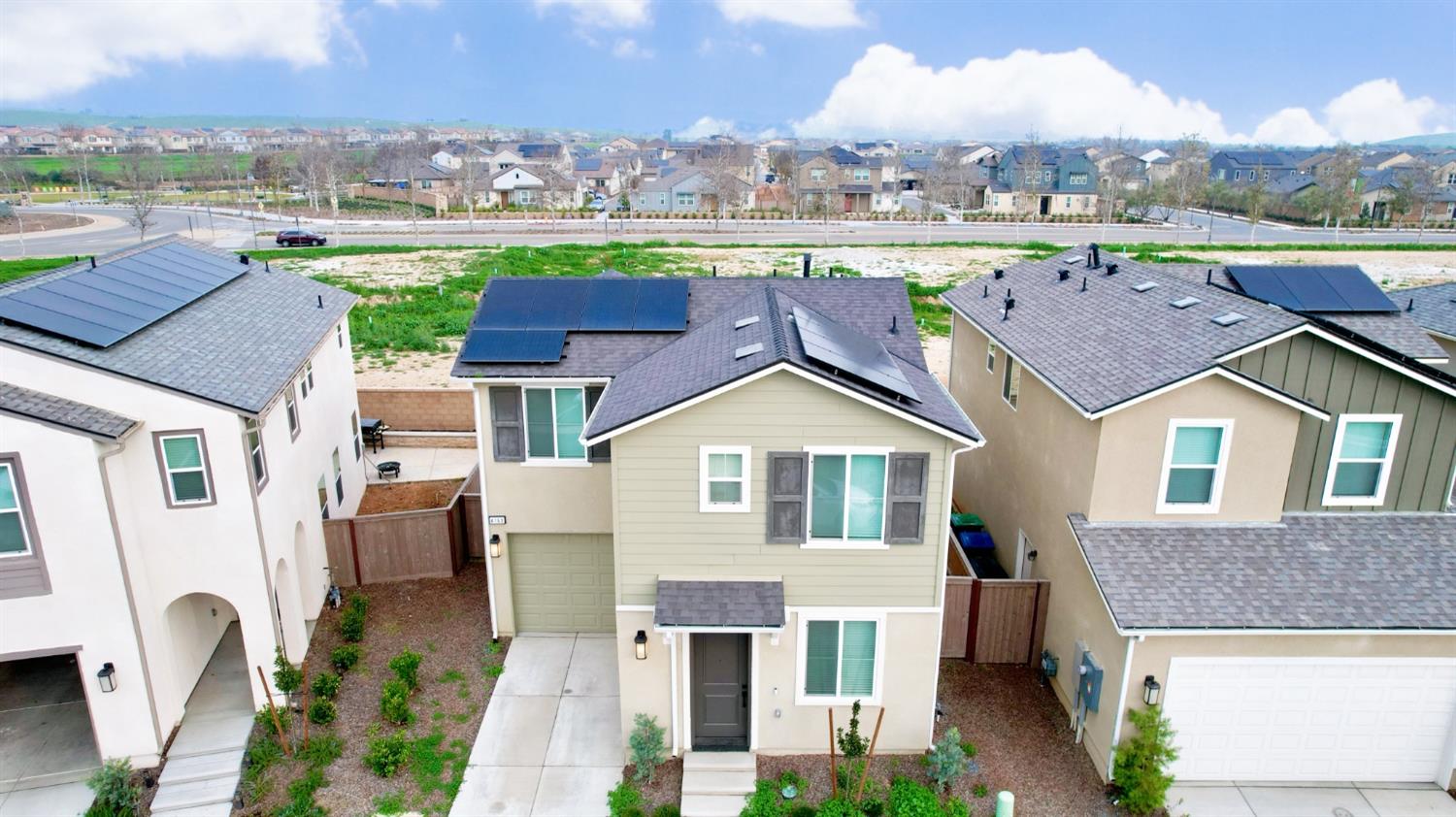 4163 Vincent Road Madera, CA 93636 - Photo 2 of 17 an aerial view of multiple houses