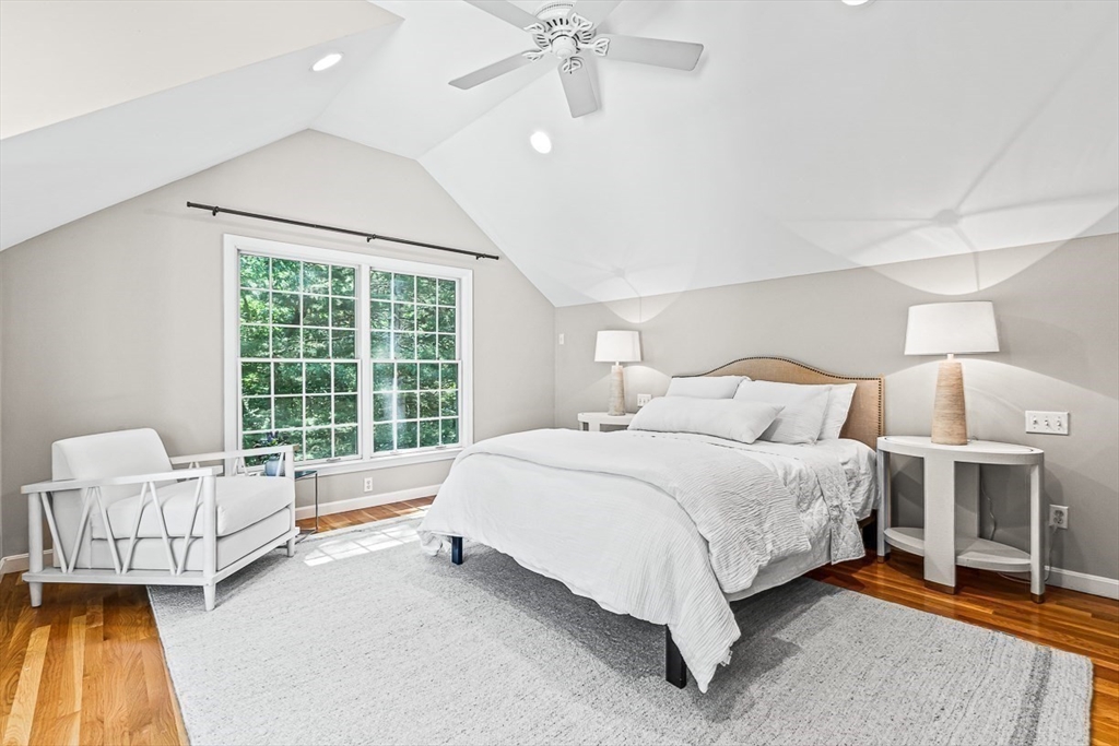 21 Madison Road Wellesley, MA 02481 - Photo 15 of 26 a spacious bedroom with a bed and a couch