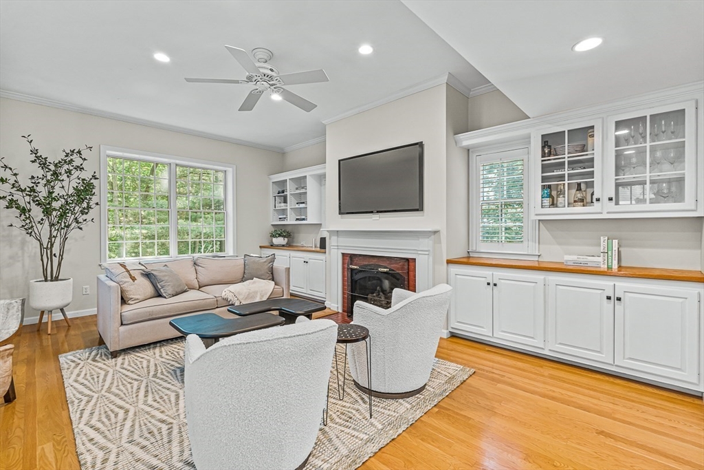 21 Madison Road Wellesley, MA 02481 - Photo 5 of 26 a living room with furniture a fireplace and a flat screen tv