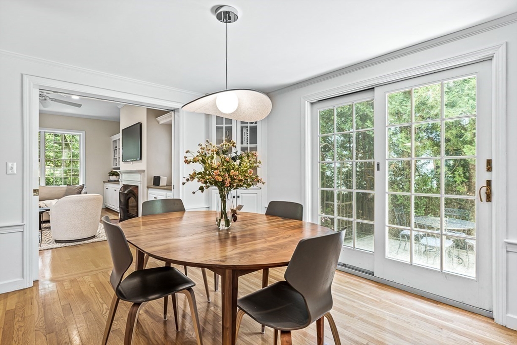 21 Madison Road Wellesley, MA 02481 - Photo 9 of 26 a dining room with furniture a chandelier and wooden floor