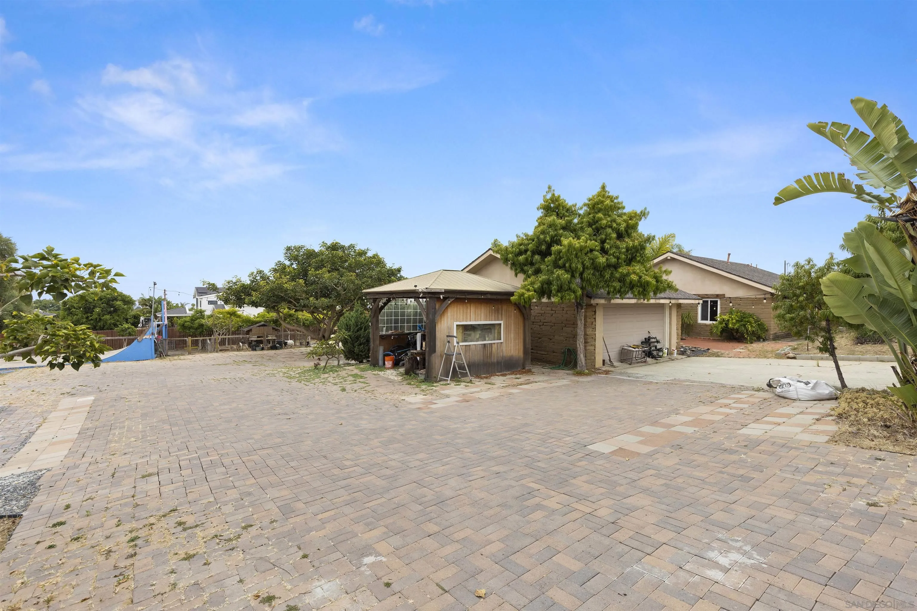 752 Bracero Road Encinitas, CA 92024 - Photo 9 of 46 a front view of a house with a yard and garage