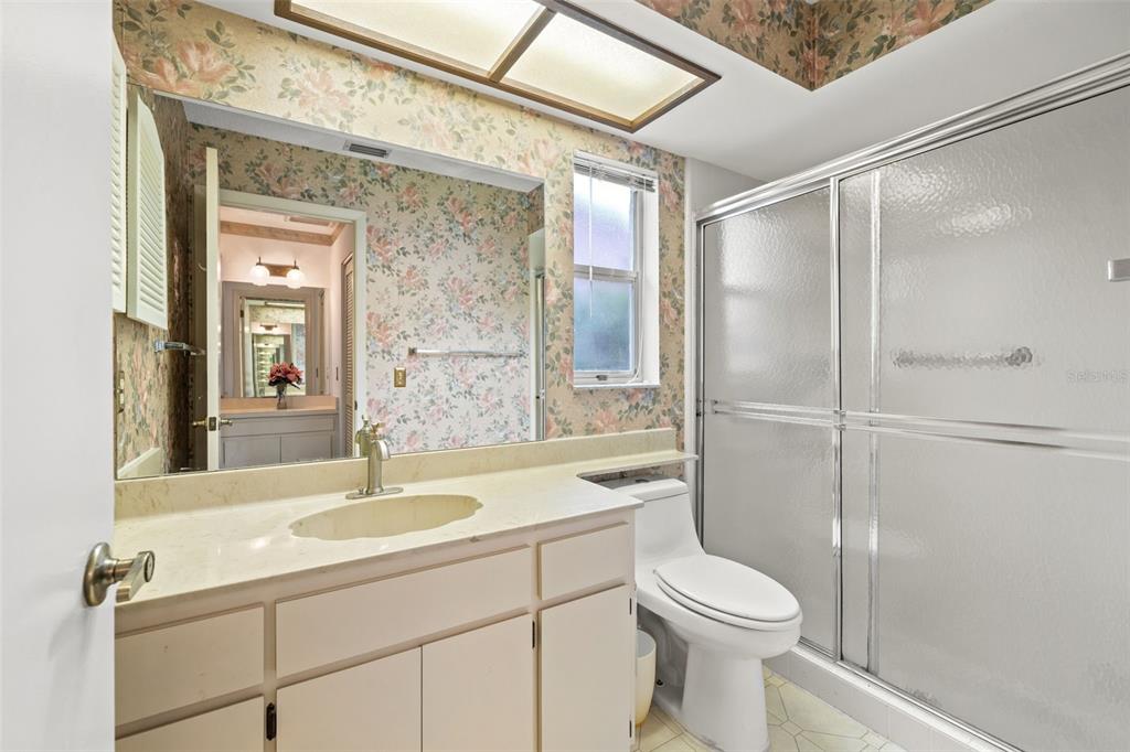 6404 Lost Tree Lane Spring Hill, FL 34606 - Photo 17 of 63 a bathroom with a sink toilet and shower